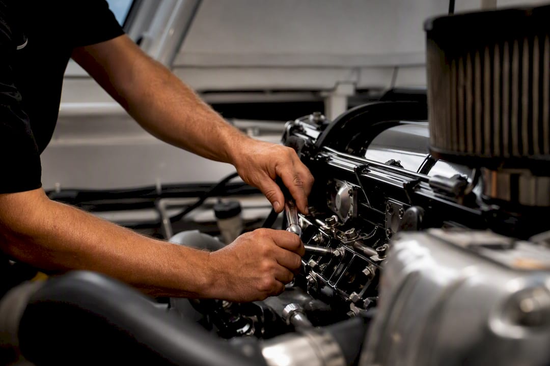 Technician hands performing yacht engine maintenance