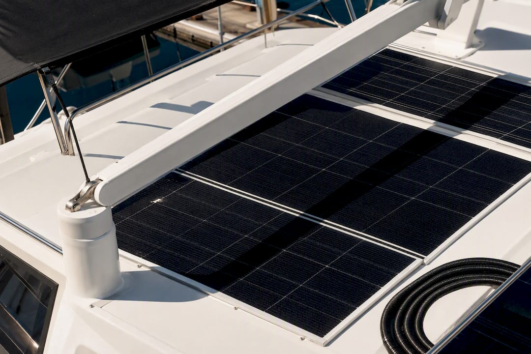 Shadows crossing solar panels on a yacht hardtop