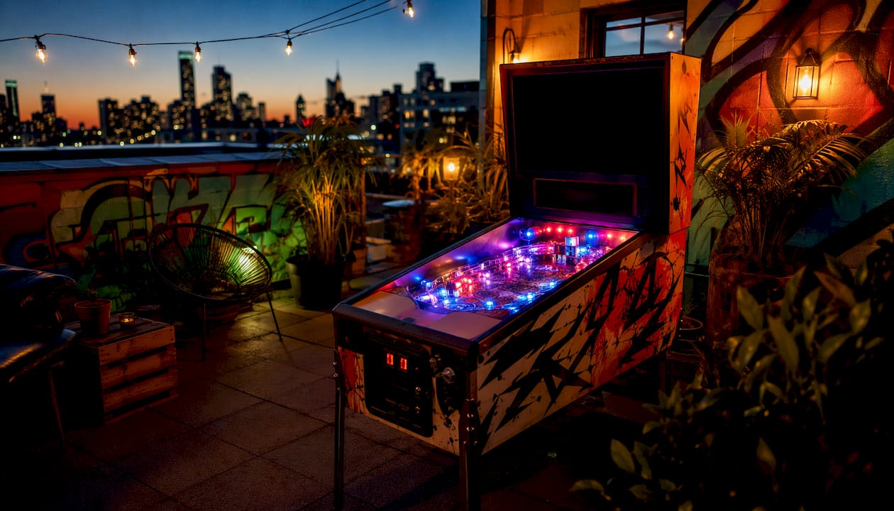 Retro home room with pinball machine and posters