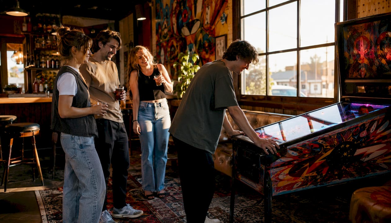 Pinball machine placed in busy bar venue