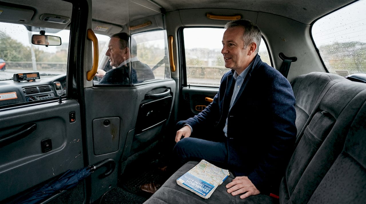 Passenger conversing with Edinburgh taxi driver