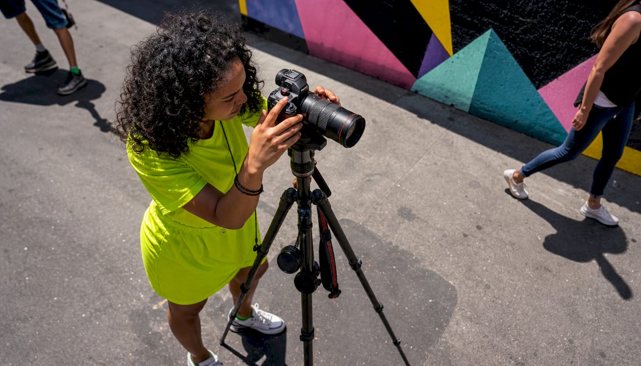 Photographer using wide lens in urban park