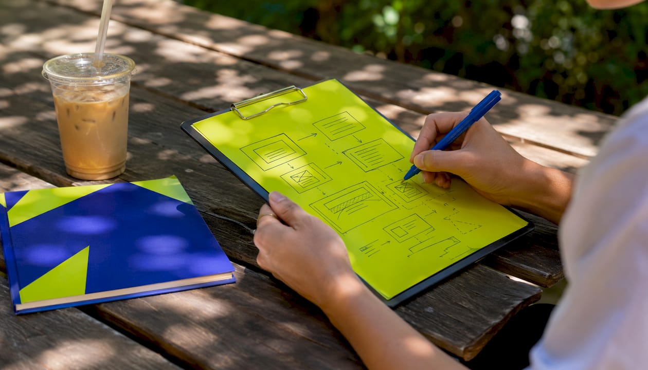 Social media content ideas for UK small businesses in 2026 1 Hands sketching social media content framework diagram