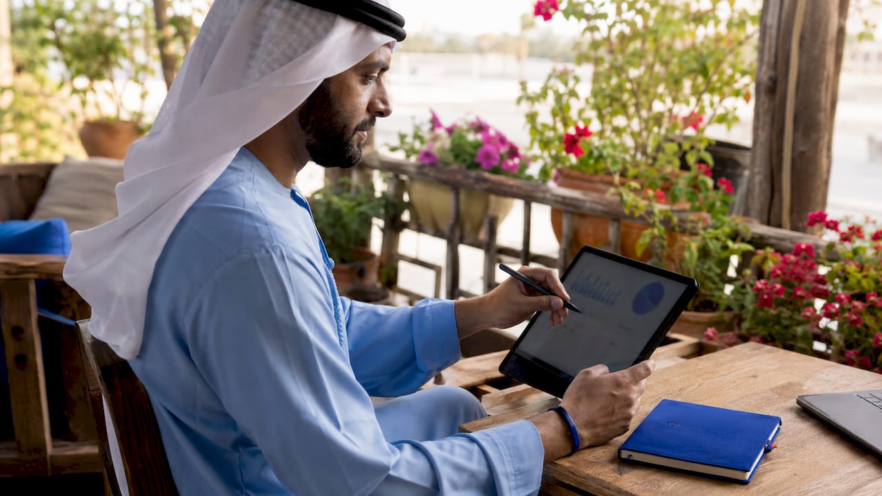 Close-up on hands using tablet for decisions