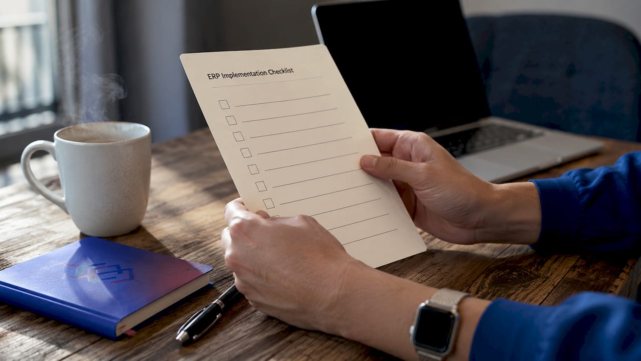 Hands holding Dynamics 365 deployment checklist