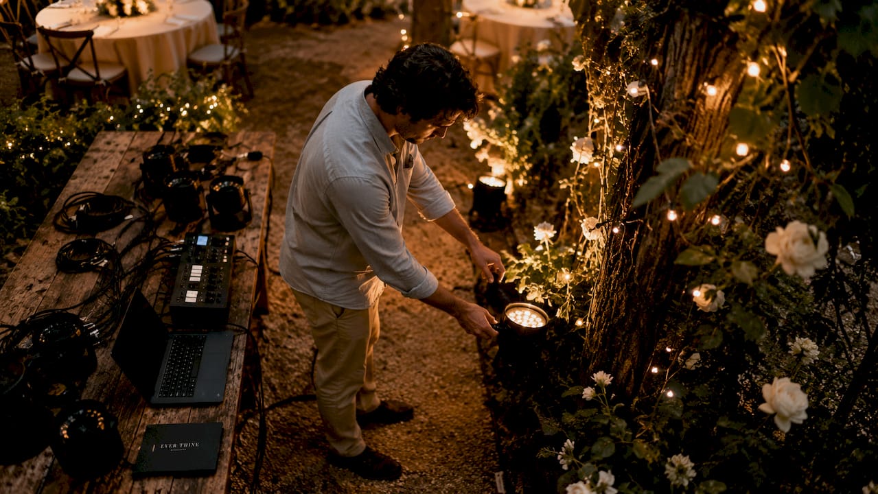 Technician setting wedding venue lighting