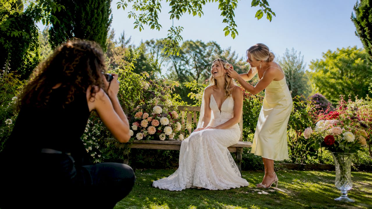 Photographer capturing bride candid laugh