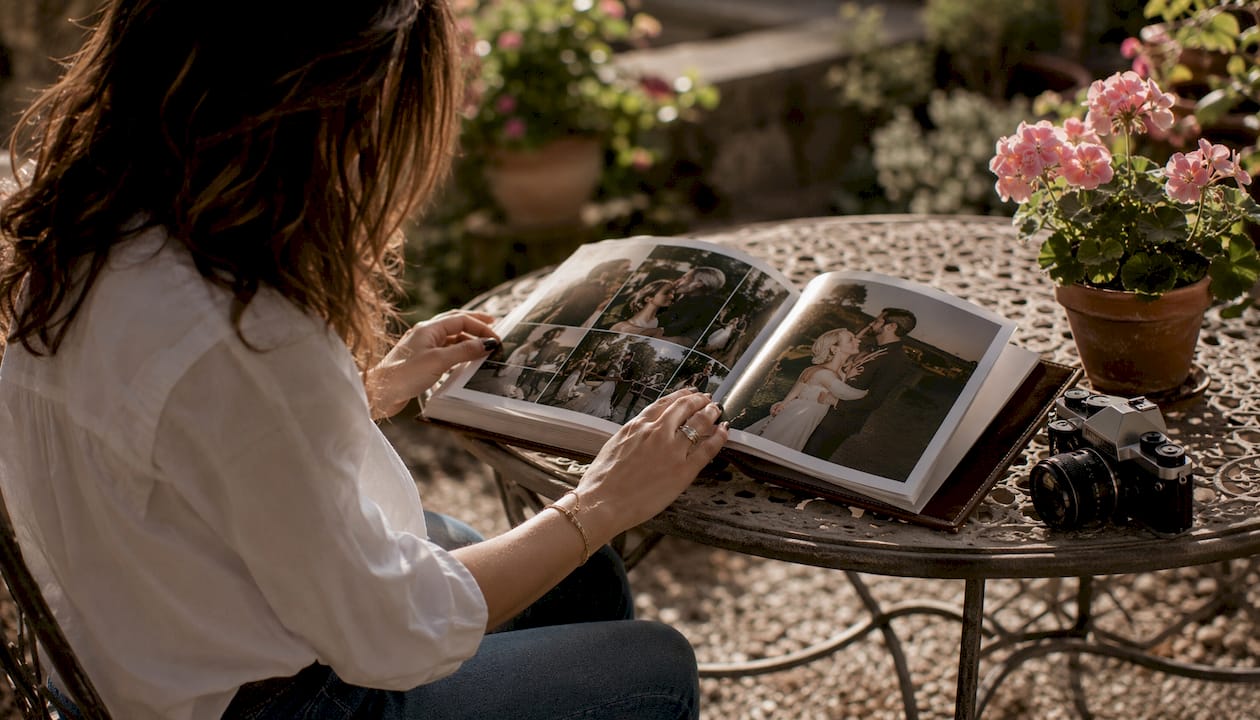 Photographer reviewing layflat wedding album