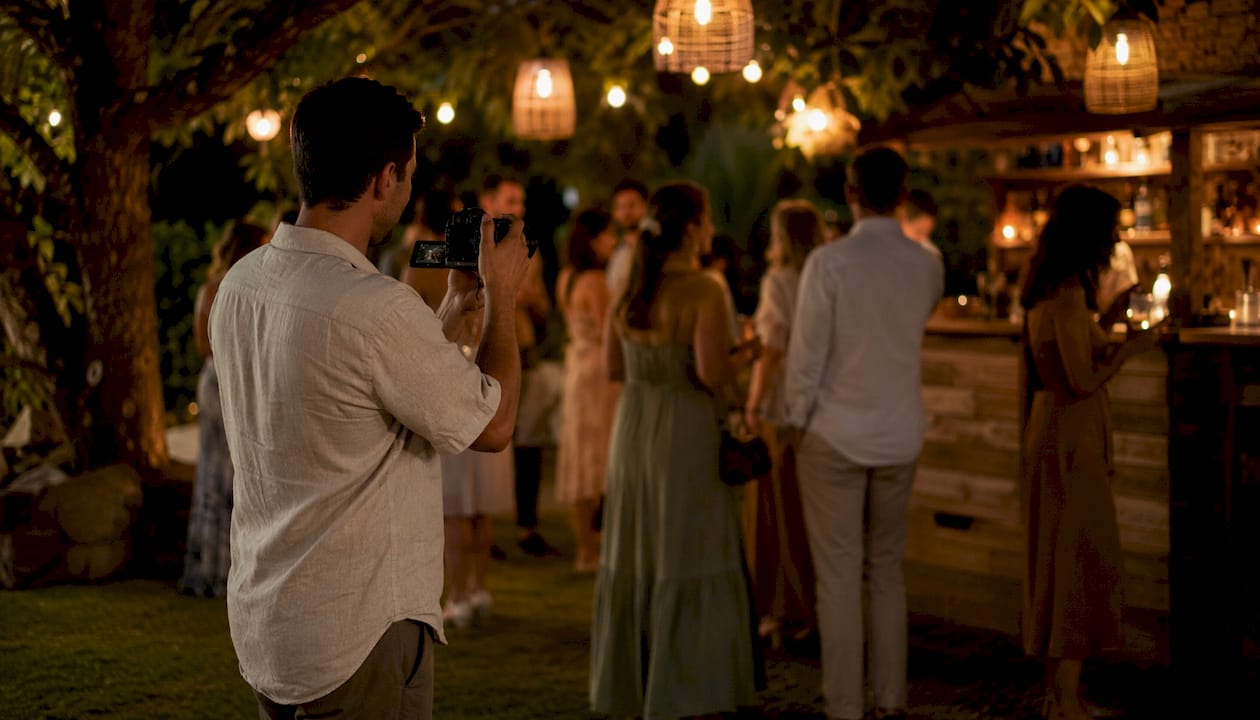 Second shooter filming candid wedding reception