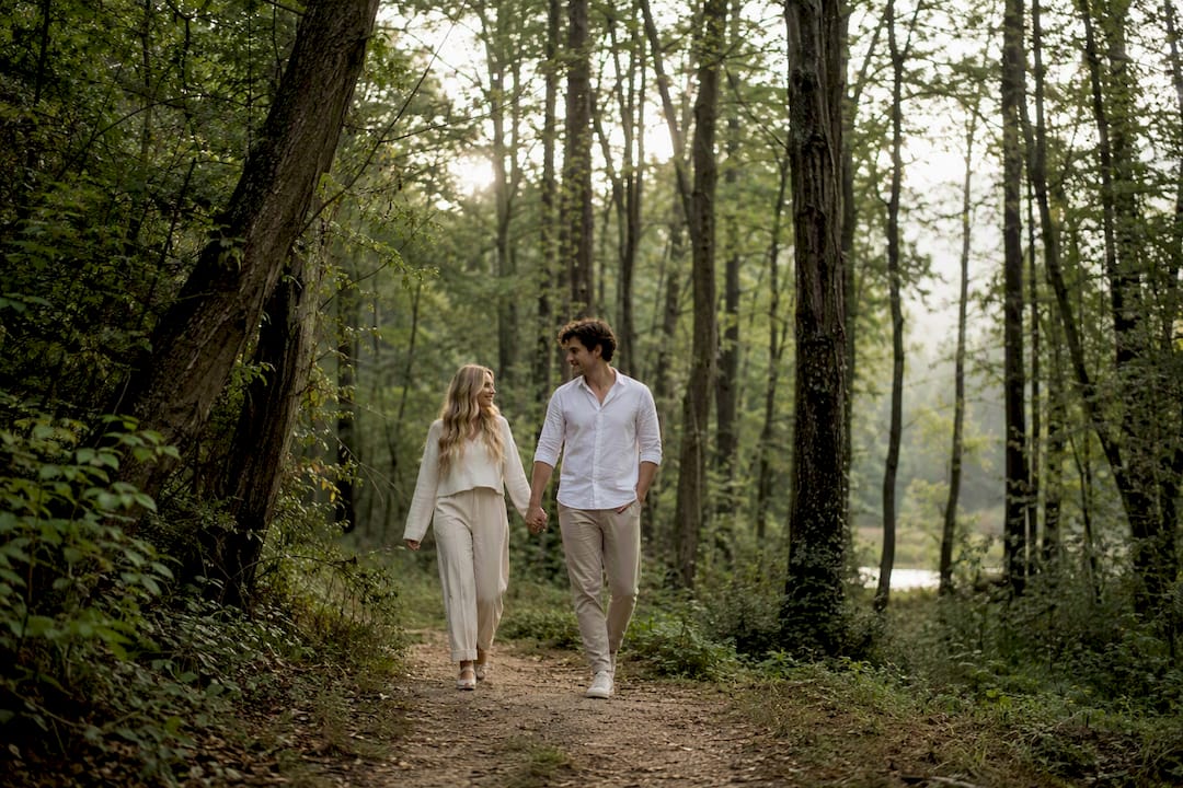 Newlyweds walking together candidly outdoors