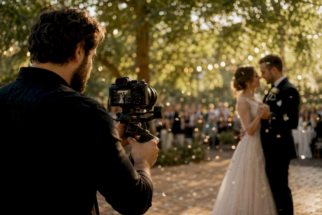 Videographer capturing wedding first dance