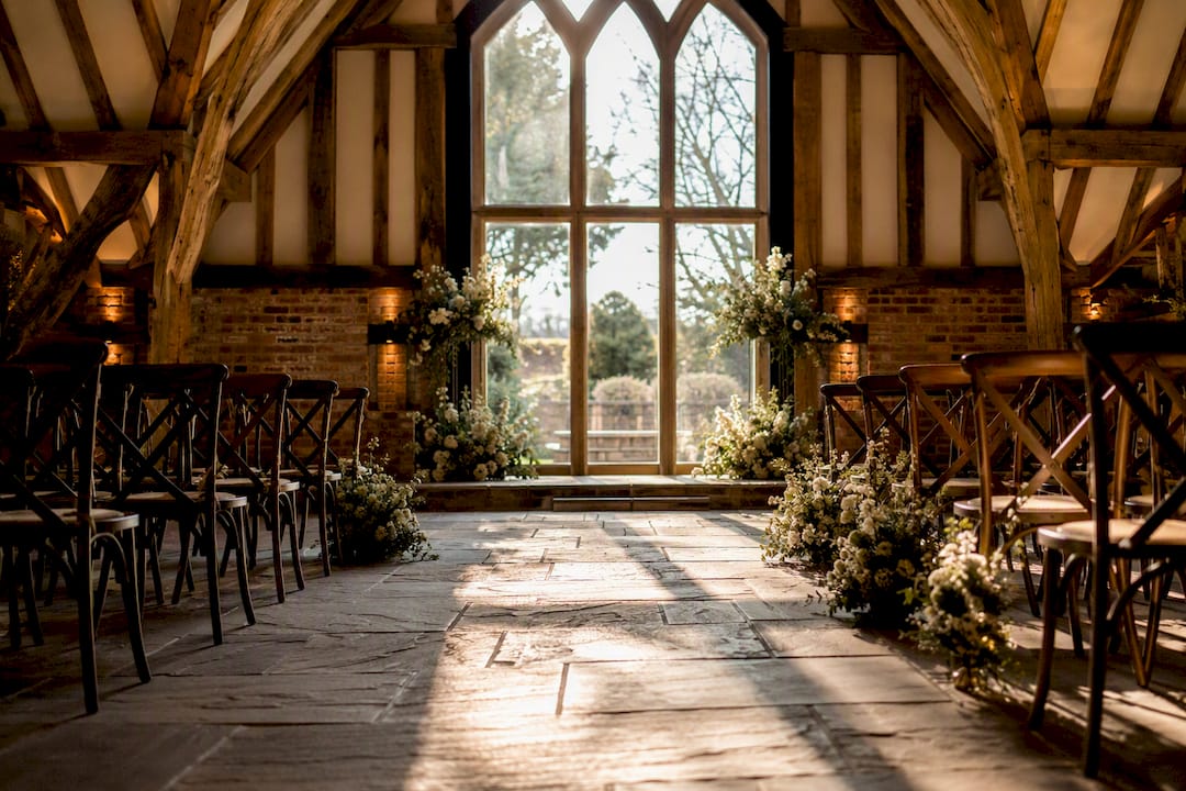 Wide interior of Shustoke Barn ceremony setup