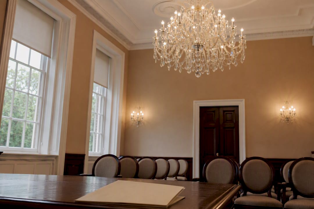 Crystal chandeliers glowing in Registry Office ceremony room
