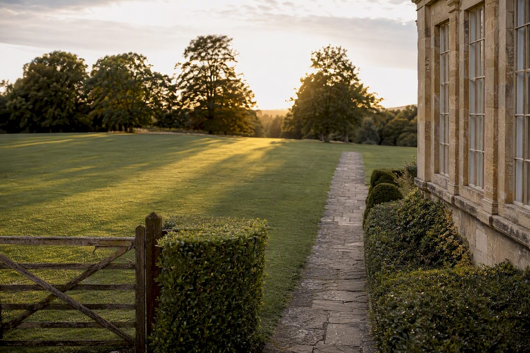 West-facing wedding venue grounds at sunset