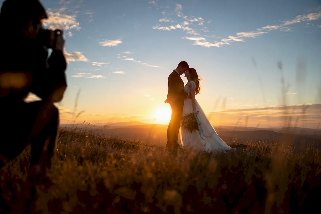 Newlyweds photographed in low sunset light