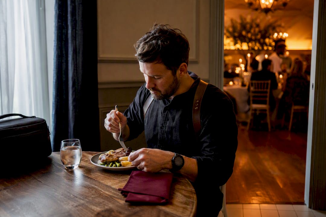Wedding photographer taking a discreet meal break