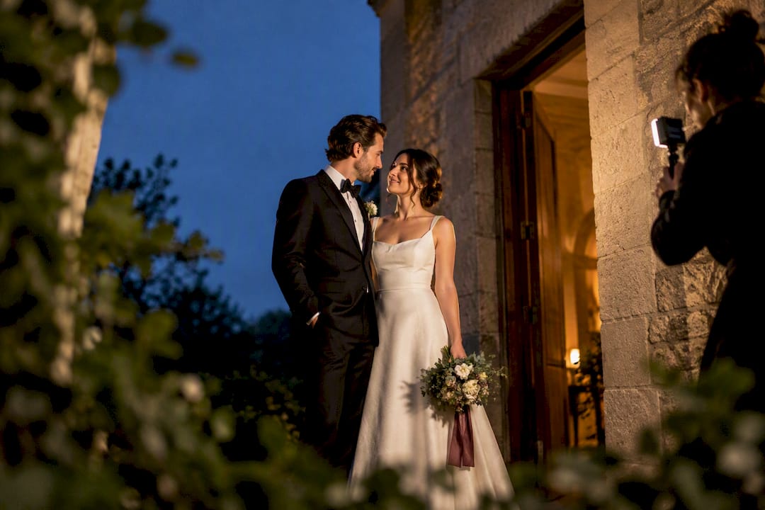 Couple posing for evening wedding portraits