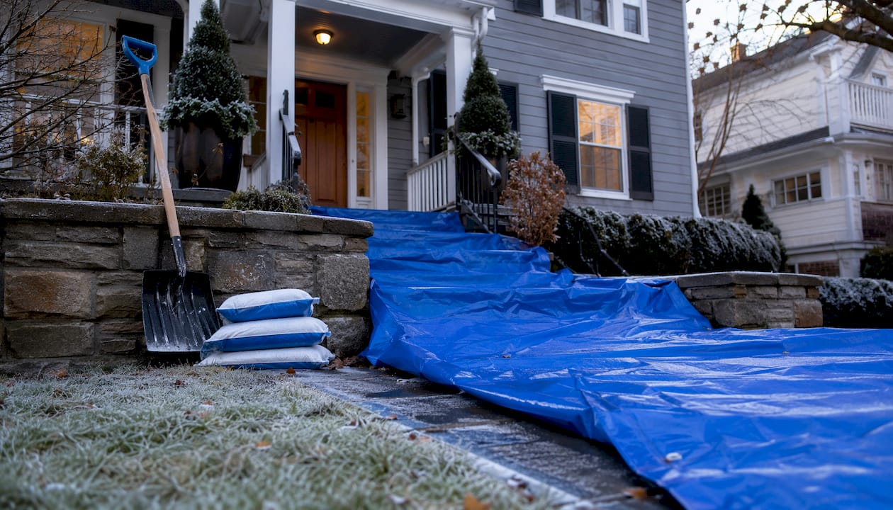 Front doorstep with tarps and snow salt