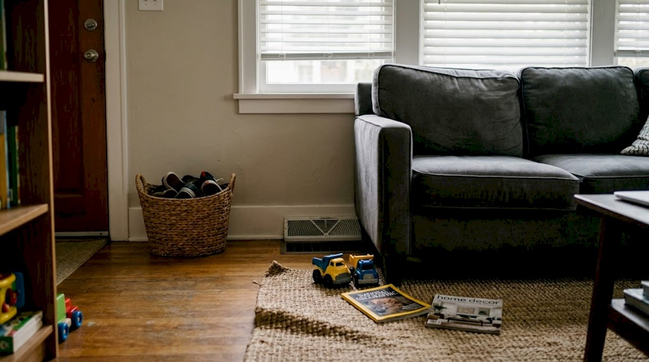 Blocked living room AC vent with sofa