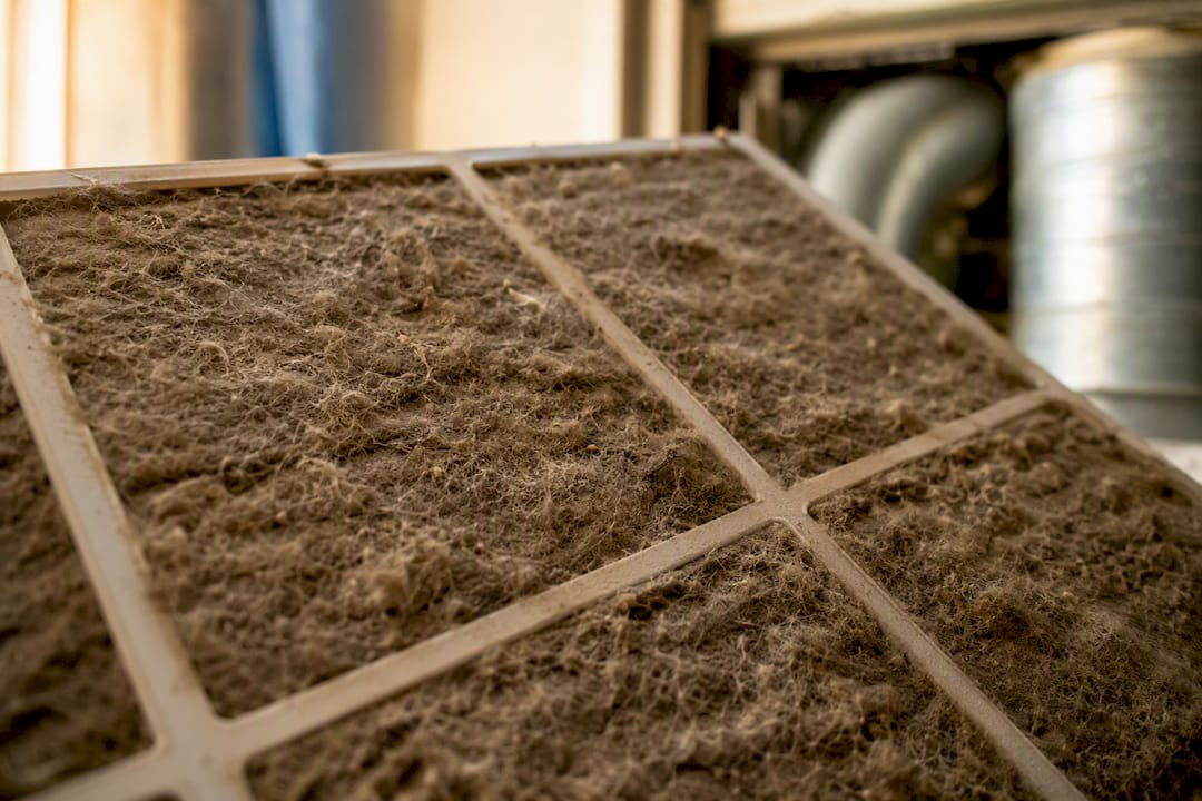 Clogged AC air filter with dust and hair