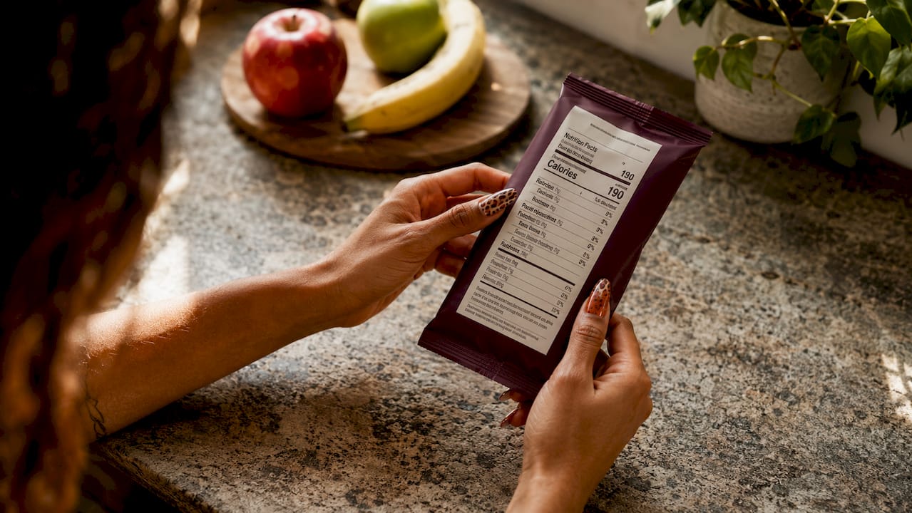 Close-up of hands holding nutrition facts label