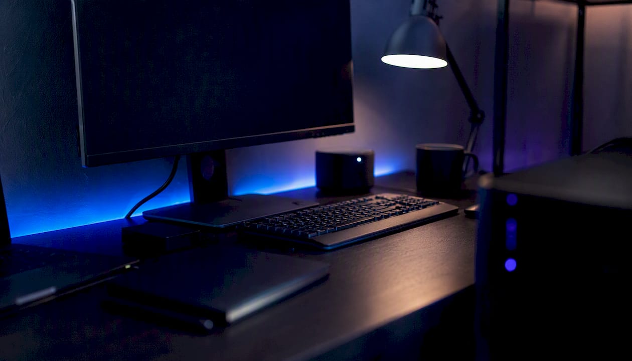 Close-up of trading analytics device with dark ambient light