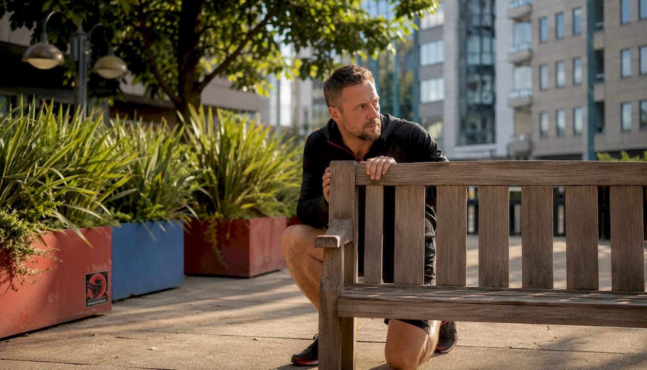 Man using table as barrier for self-protection