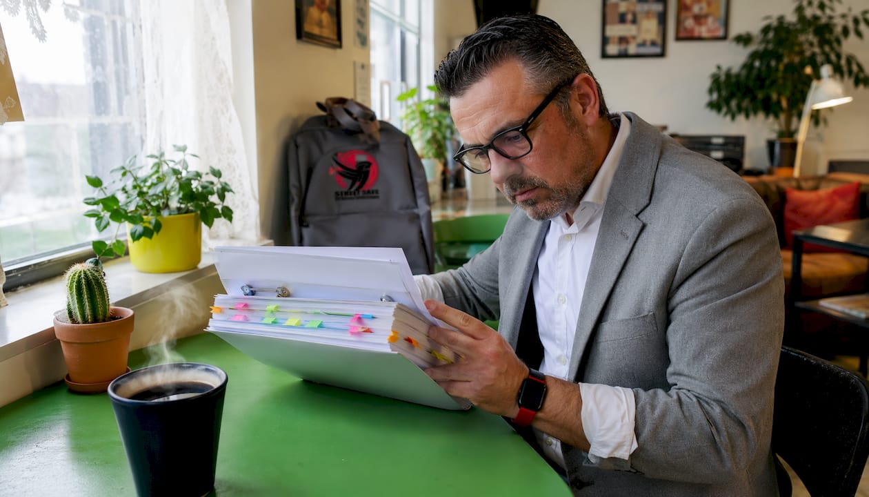 Compliance officer reviewing legal training documents