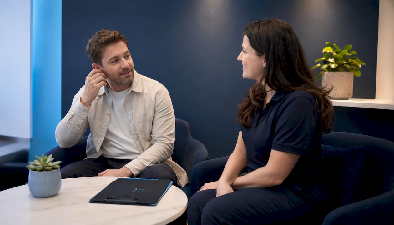Patient consulting practitioner about ear care