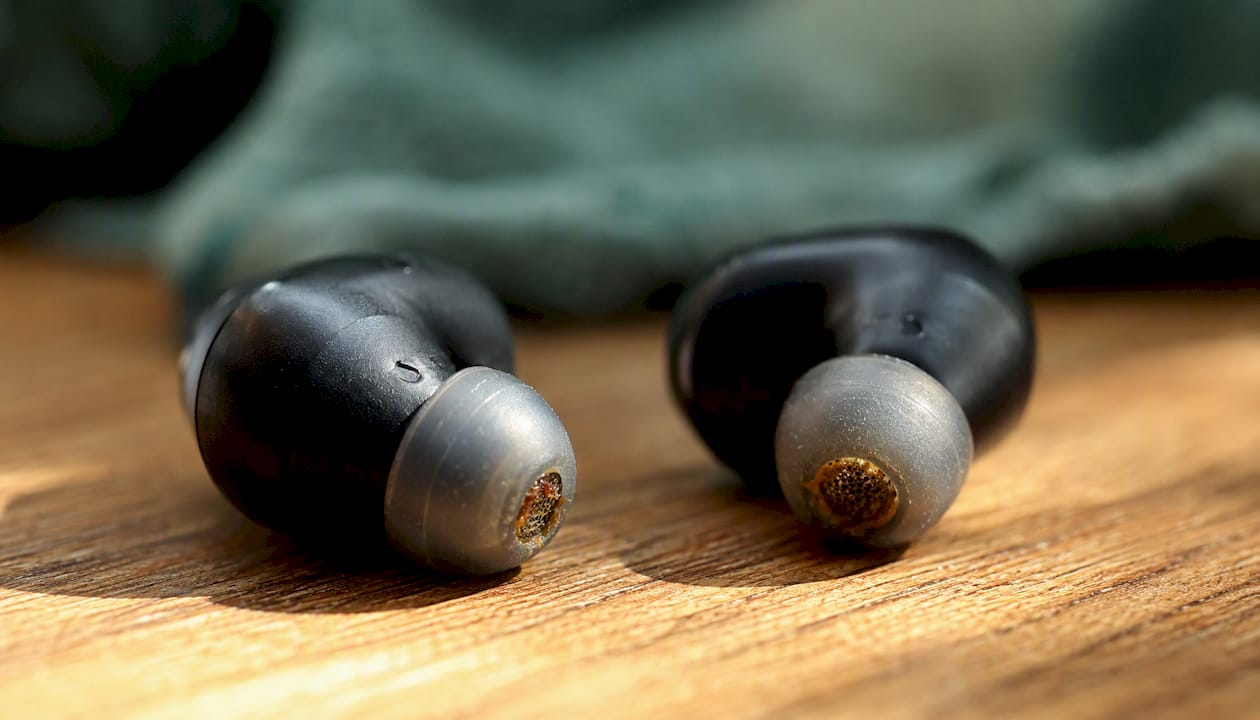 Close-up of earbuds with earwax buildup
