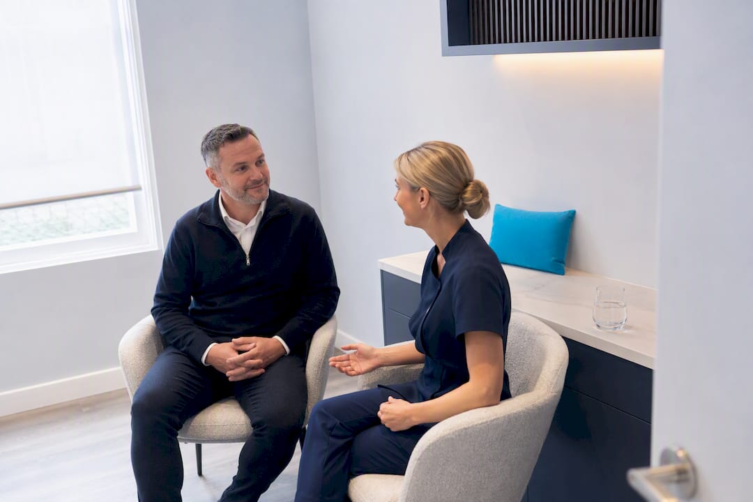 Patient discussing ear clinic appointment costs