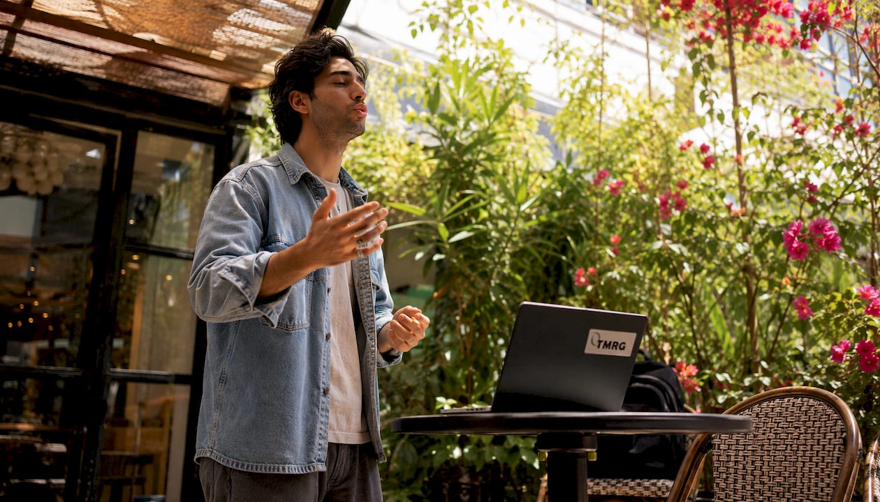 Male singer practicing vocal warm-up outdoors
