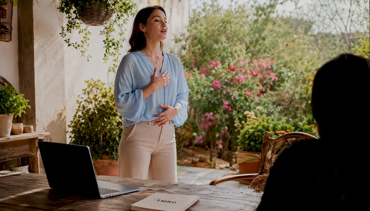 Female vocal coach demonstrating posture