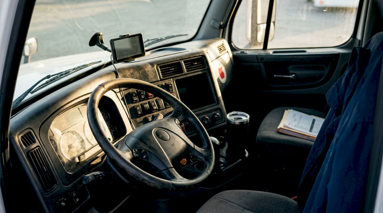 Interior view of day cab driver’s seat and controls