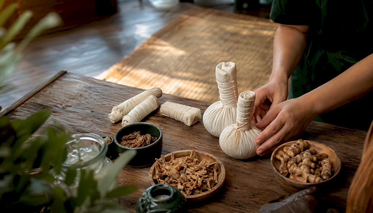 Close-up of dried herbal compress bundles