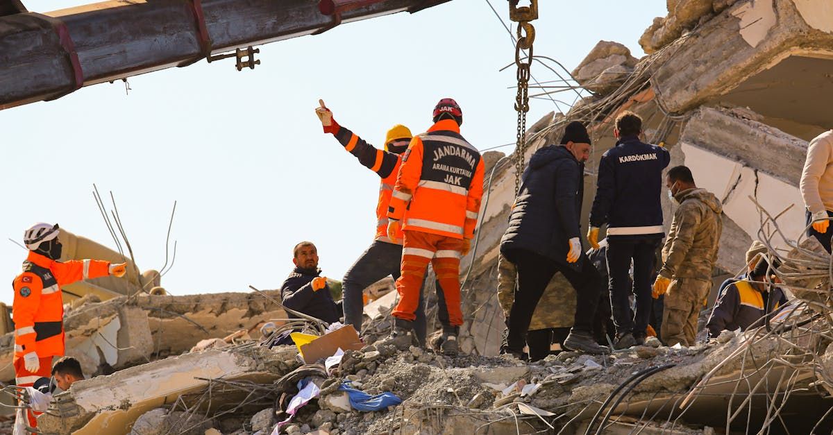 Community and experts collaborating at disaster site after damage