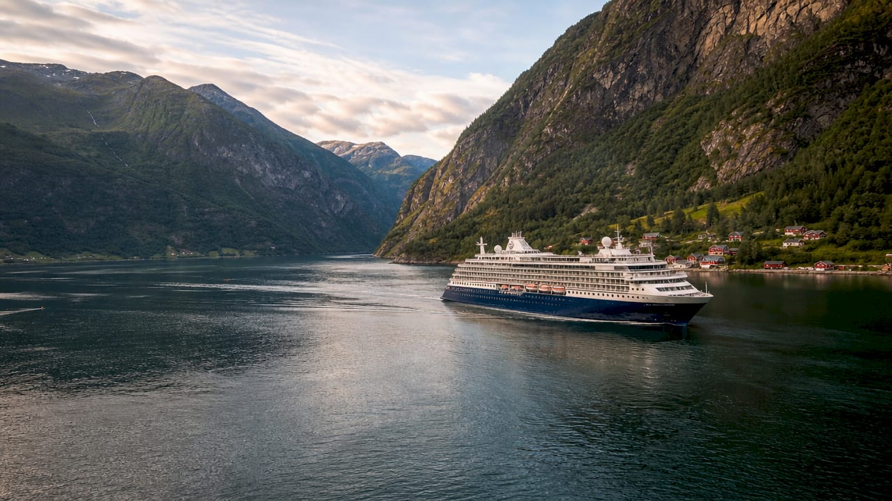 Cruise ship sailing through Northern European fjord