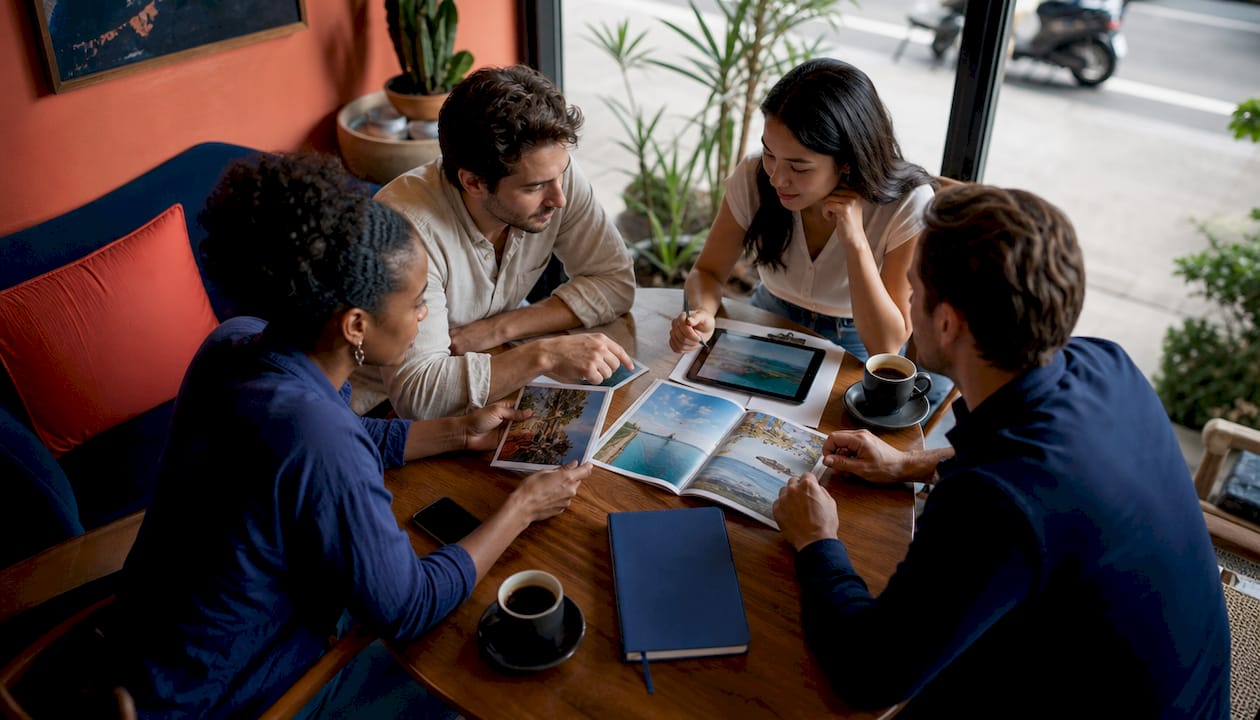 Group planning milestone travel logistics in bright workspace