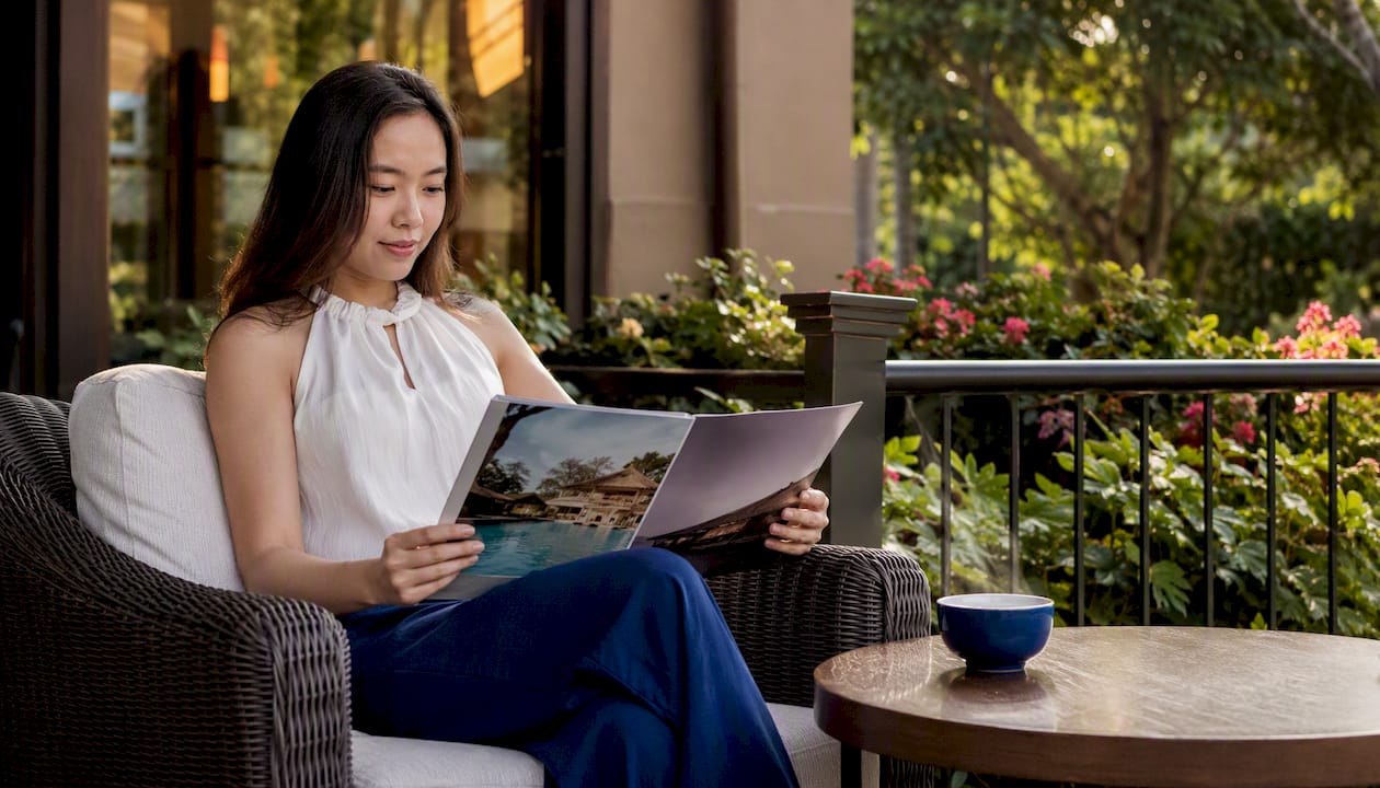 Young woman researching exclusive luxury travel spots