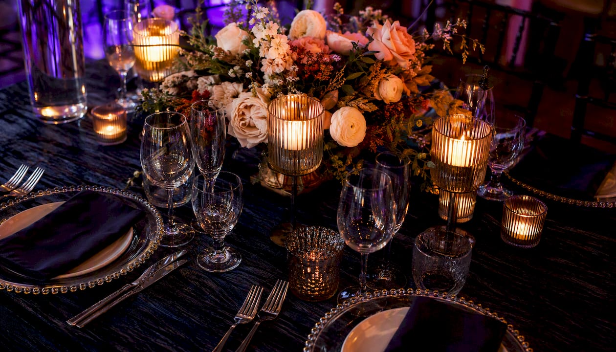 Custom lighting and floral design at wedding reception