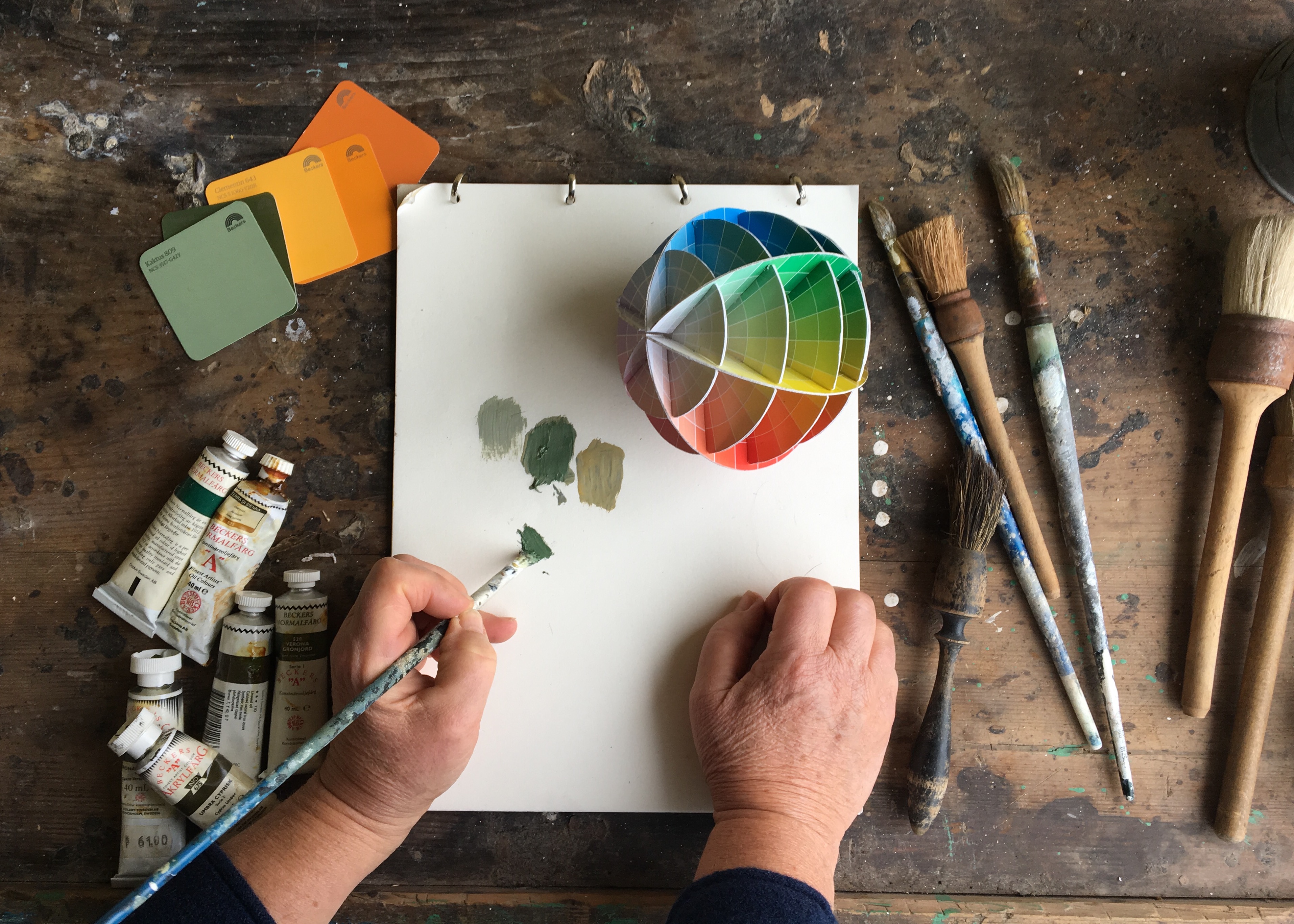 Artist selects colours using colour wheel