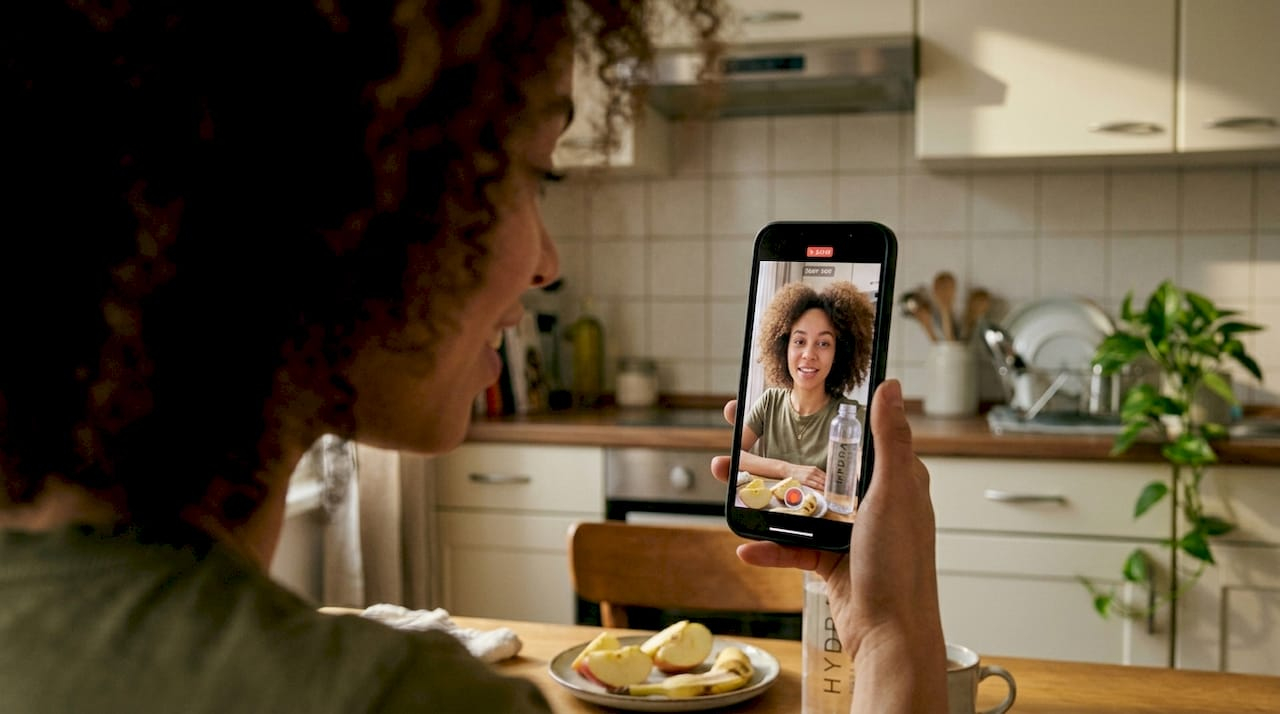 Creator filming product review selfie at home