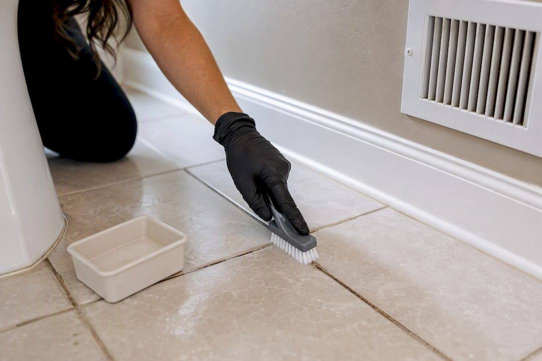 Cleaner scrubbing grout during rental turnover