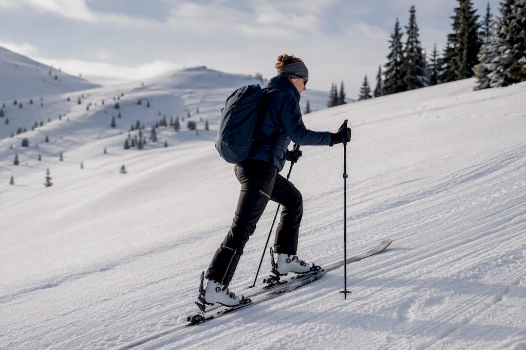 Ski tourer ascending a groomed skin track