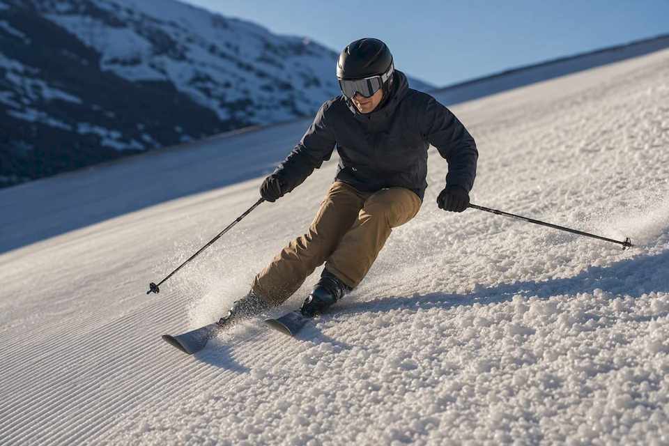 Skier turning through softened spring snow